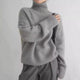 Women's relaxed turtleneck sweater with long sleeves and ribbed trims