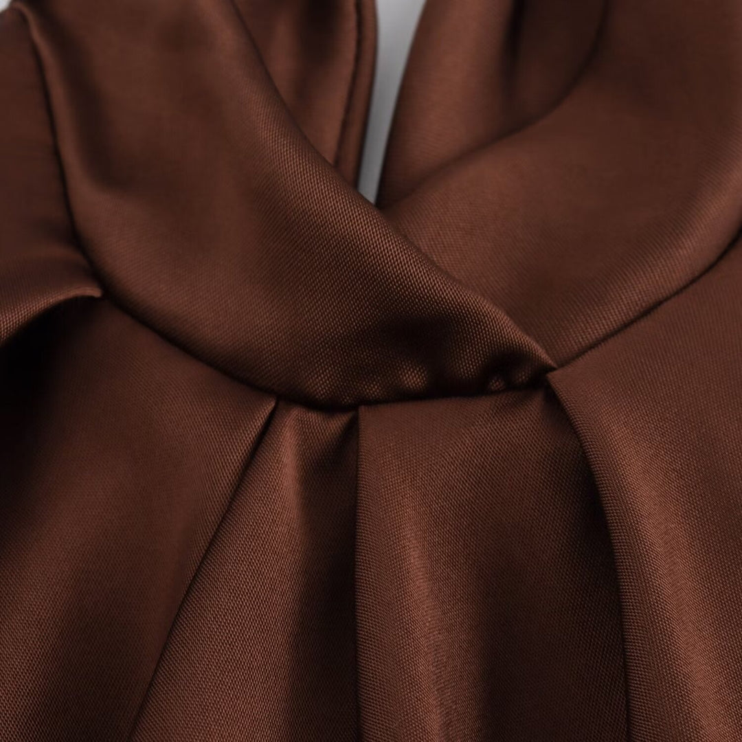 Women's brown sleeveless halter maxi dress with a slim floor-length silhouette