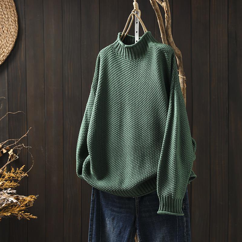 Women's textured knit sweater with ribbed crew neck and long sleeves