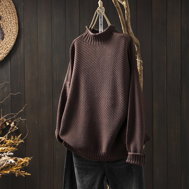 Women's textured knit sweater with ribbed crew neck and long sleeves