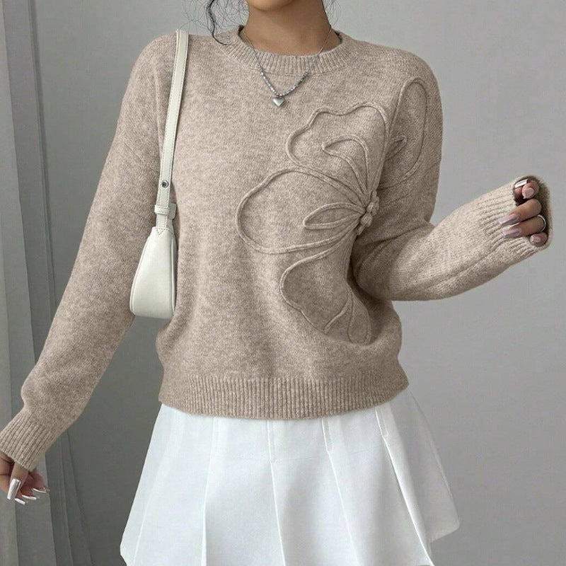 Women's crew neck sweater with long sleeves and raised floral front detail