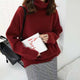 Women's relaxed turtleneck sweater with long sleeves and ribbed trims