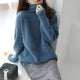 Women's relaxed turtleneck sweater with long sleeves and ribbed trims