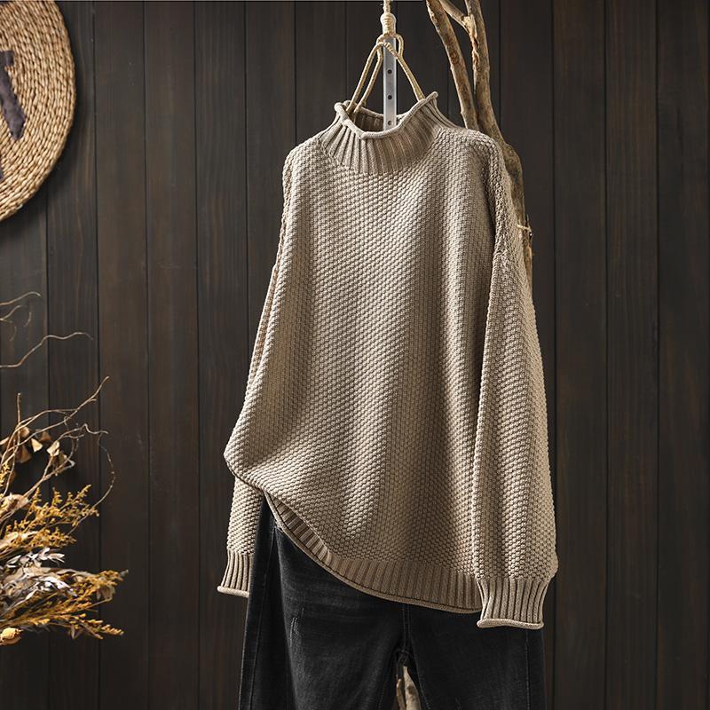 Women's textured knit sweater with ribbed crew neck and long sleeves