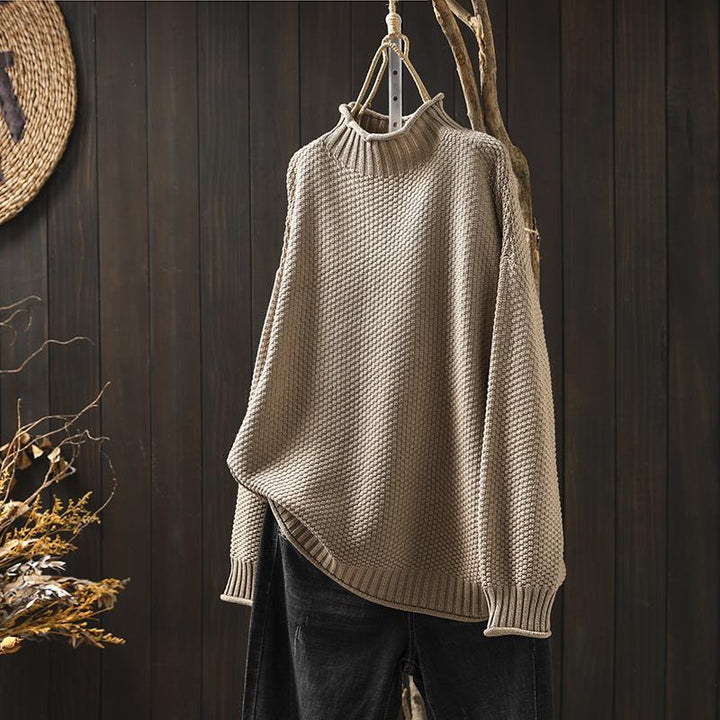 Women's textured knit sweater with ribbed crew neck and long sleeves