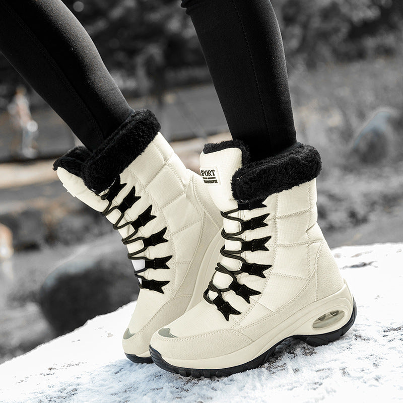 High-top winter lace-up boots with plush black trim and chunky ridged soles