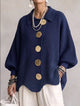 Women's oversized textured collared cardigan with large buttons and curved hem