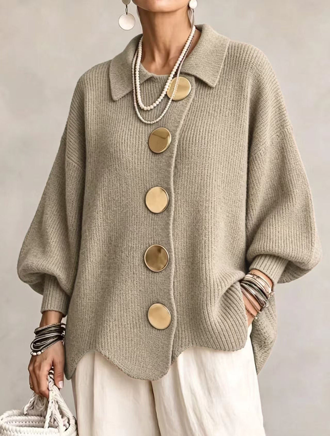 Women's oversized textured collared cardigan with large buttons and curved hem