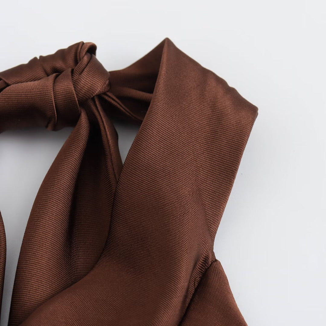 Women's brown sleeveless halter maxi dress with a slim floor-length silhouette