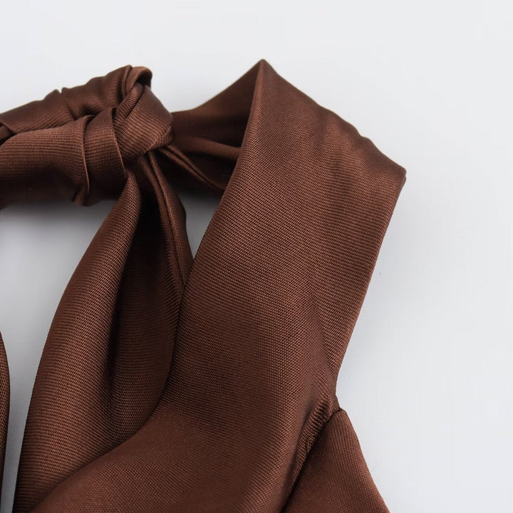 Women's brown sleeveless halter maxi dress with a slim floor-length silhouette