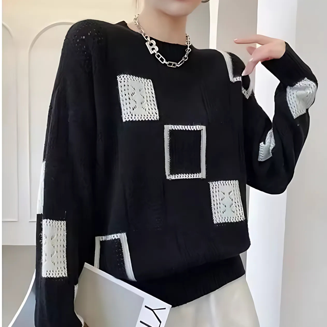 Women's patchwork crew-neck sweater with contrasting geometric panels