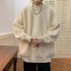 Oversized wavy knit sweater with crew neck, long sleeves and ribbed trims
