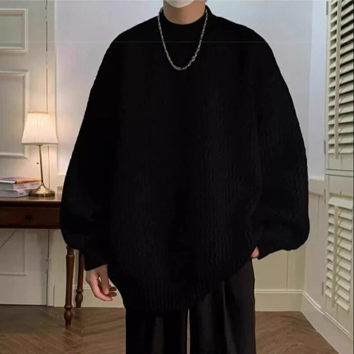 Oversized wavy knit sweater with crew neck, long sleeves and ribbed trims