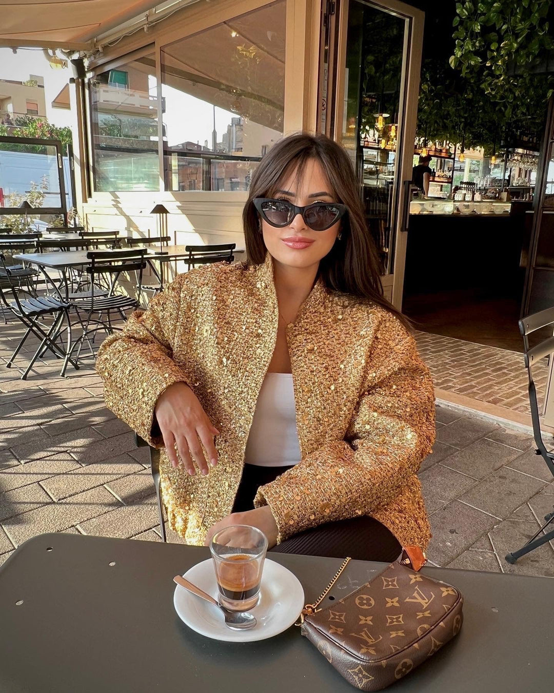 Women's textured metallic jacket with stand collar, long sleeves and front pockets