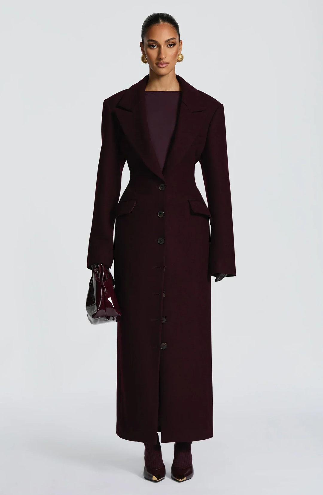 Women's burgundy tailored longline coat with notch lapels and button front