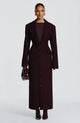 Women's burgundy tailored longline coat with notch lapels and button front