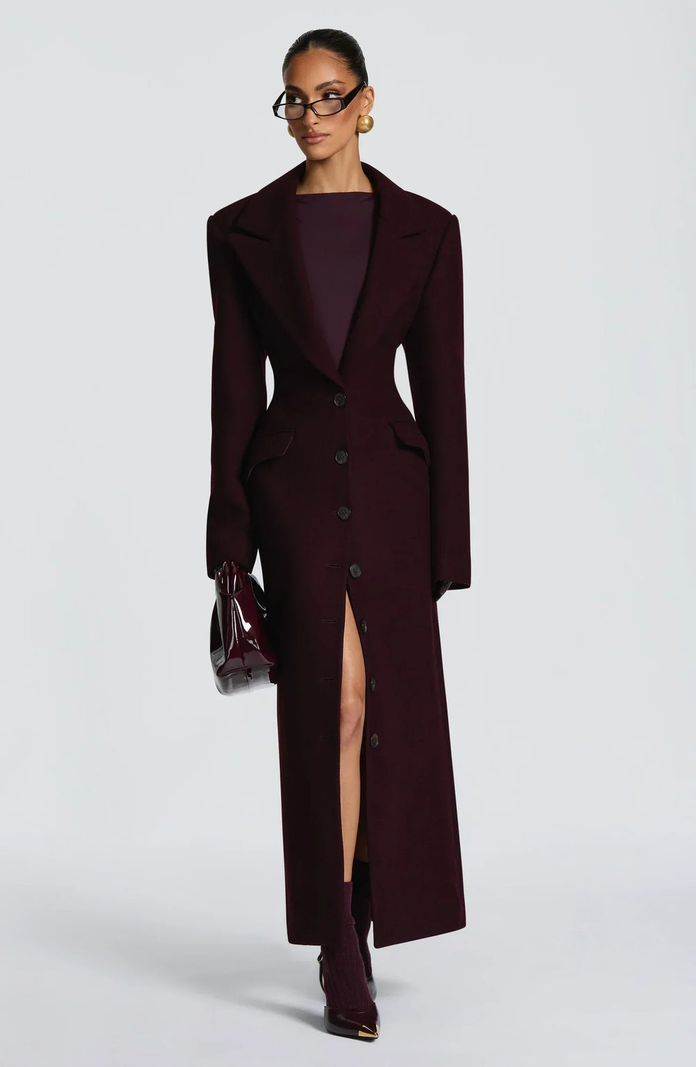 Women's burgundy tailored longline coat with notch lapels and button front