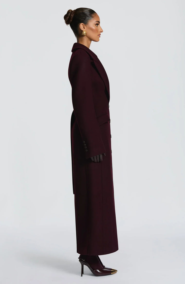 Women's burgundy tailored longline coat with notch lapels and button front
