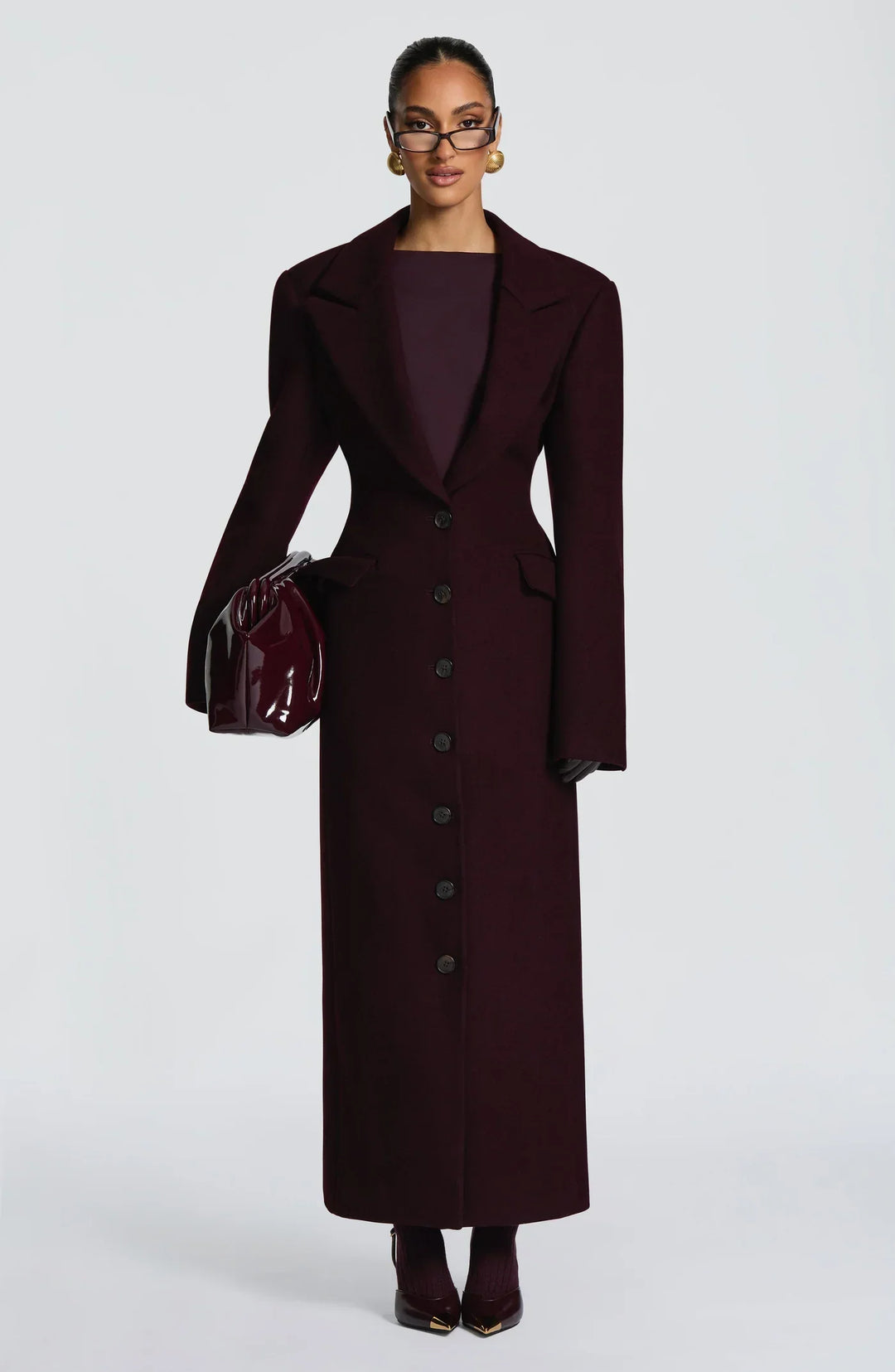 Women's burgundy tailored longline coat with notch lapels and button front