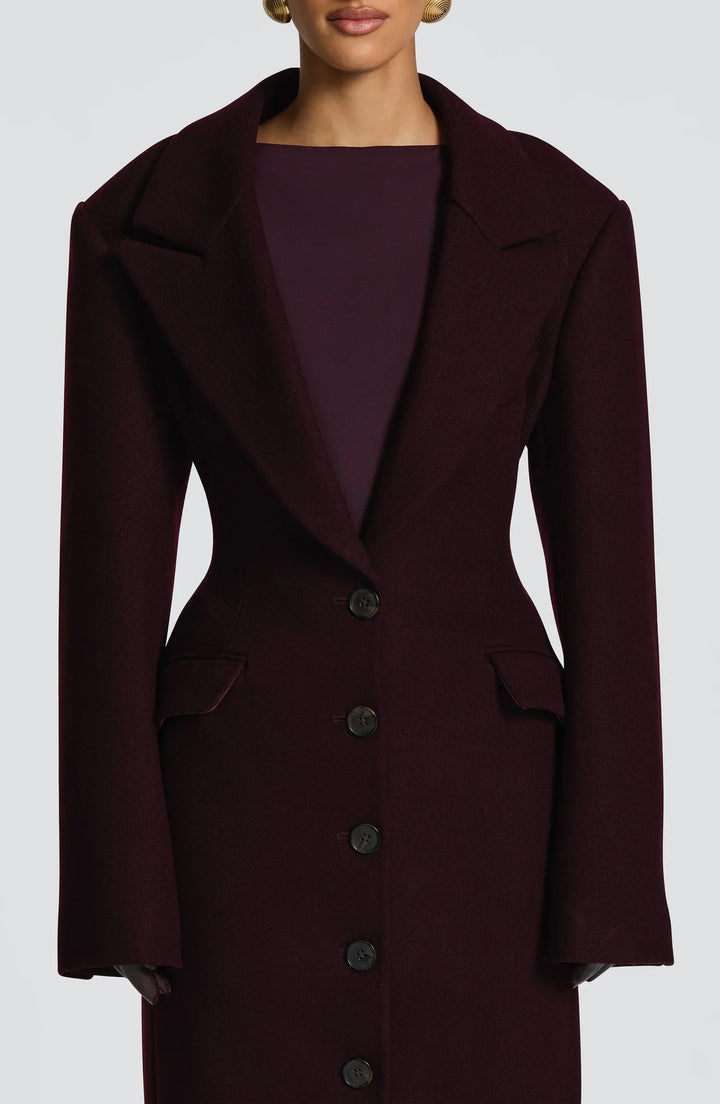 Women's burgundy tailored longline coat with notch lapels and button front