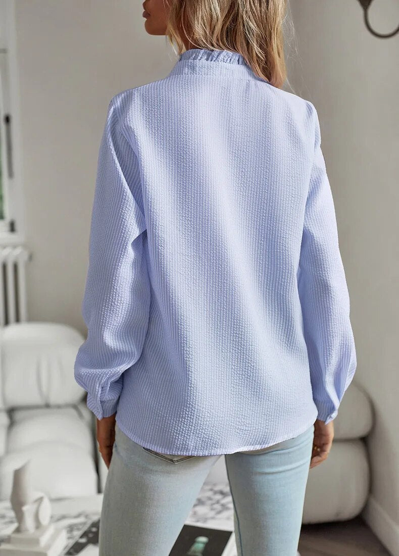 Women's ruffled button-front blouse with stand collar and long sleeves