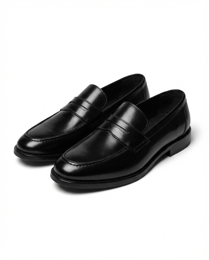 Men's penny loafers with rounded toes, low heels and vamp strap detail