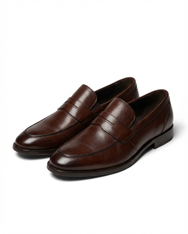 Men's penny loafers with rounded toes, low heels and vamp strap detail