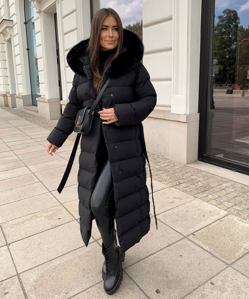 Women's black long quilted puffer coat with fur-look hood