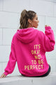 Women's long-sleeve hooded sweatshirt with stacked text graphic on the back