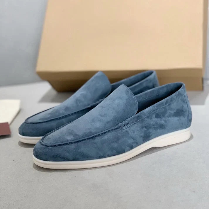 Slip-on loafers with moc-toe stitching and flat contrasting soles
