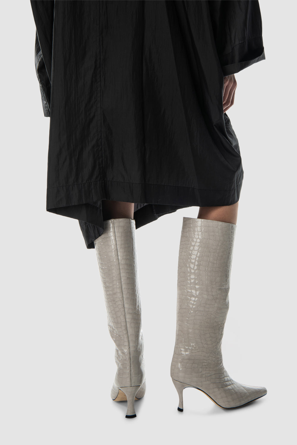 Women's beige croco embossed knee-high boots with pointed toes and stiletto heels
