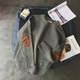 Men's crew neck pullover sweater with long sleeves and contrasting elbow patches