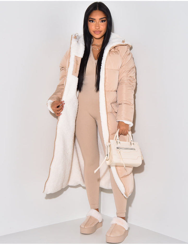Women's longline reversible hooded quilted jacket shown with fleece-look lining
