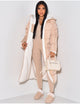 Women's longline reversible hooded quilted jacket shown with fleece-look lining