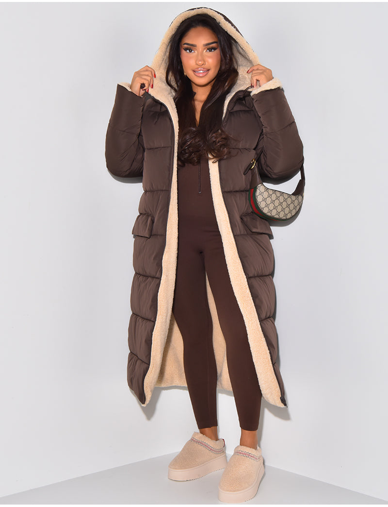 Women's longline reversible hooded quilted jacket shown with fleece-look lining