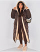 Women's longline reversible hooded quilted jacket shown with fleece-look lining