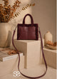 Burgundy shopper bag with faux fur trim, top handles and long shoulder strap