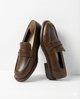 Olive women's penny loafers with round toes and low heels