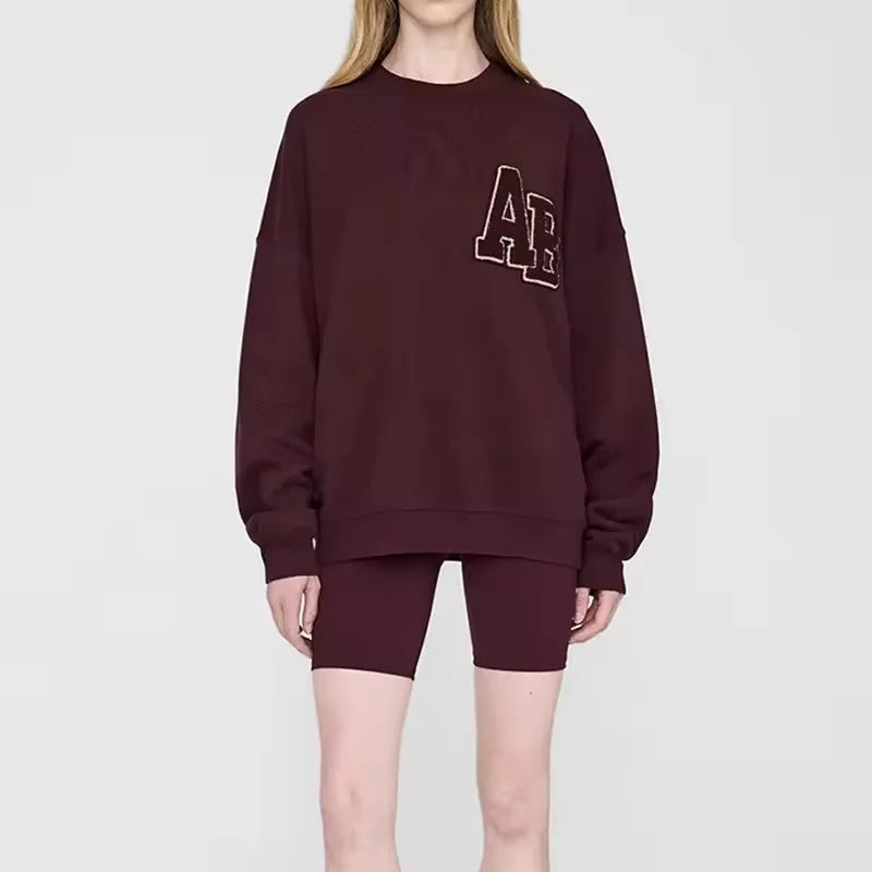 Women's long sleeve crew neck sweatshirt with front graphic detail