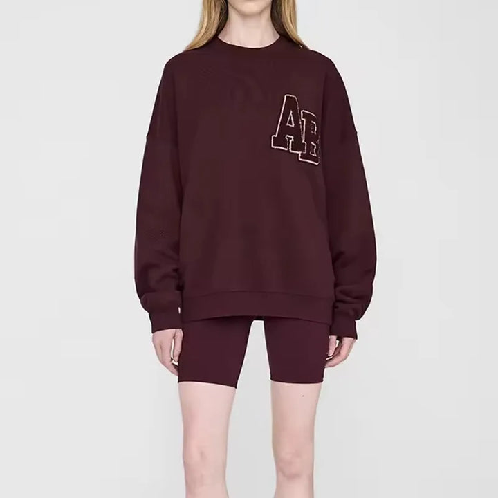 Women's long sleeve crew neck sweatshirt with front graphic detail
