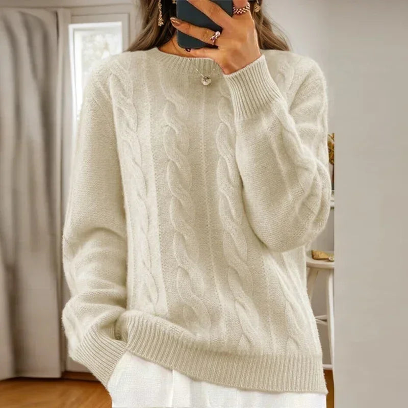 Women's cable knit crew neck sweater with long sleeves and ribbed trims