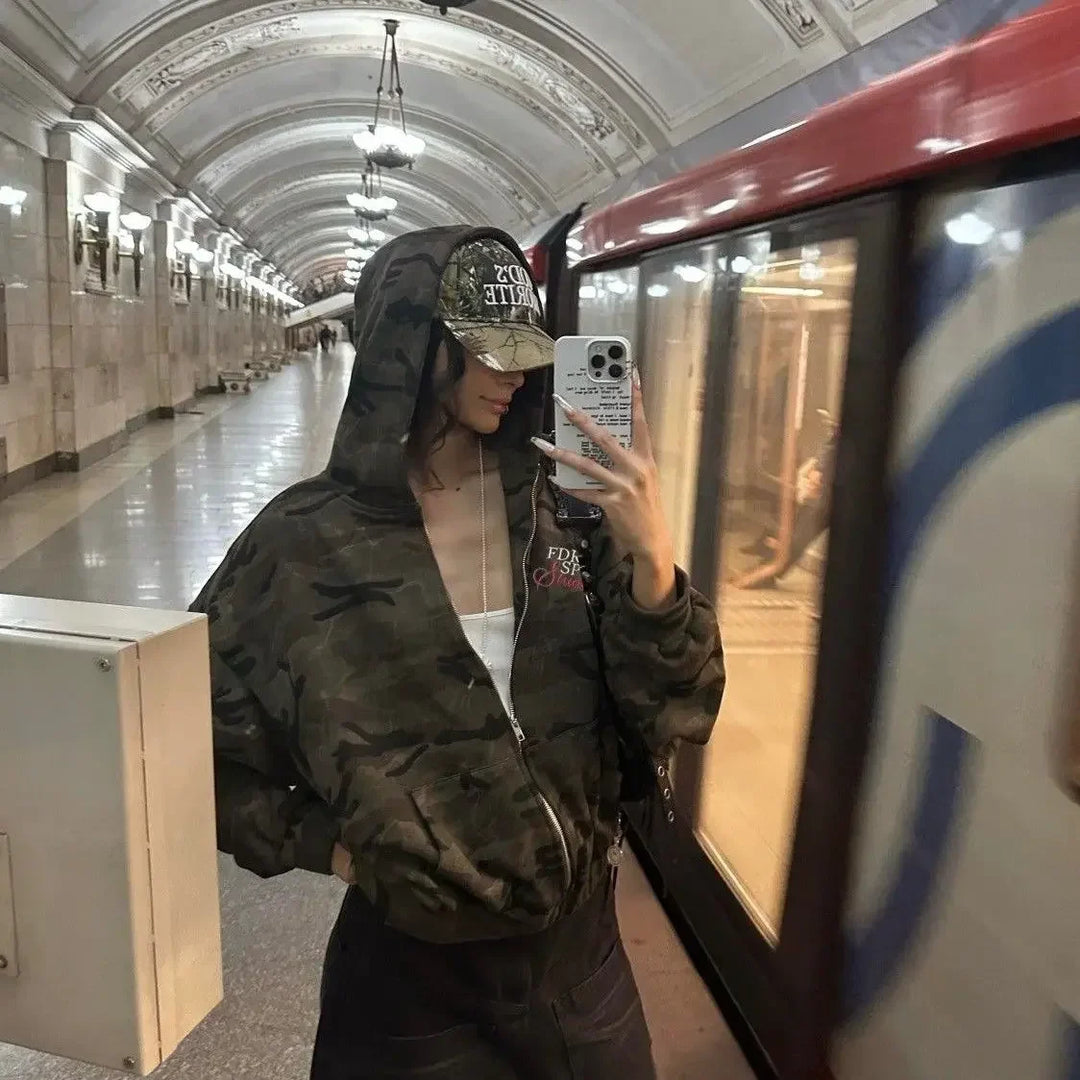 Women's brown camouflage zip hoodie with hood and red sleeve detail