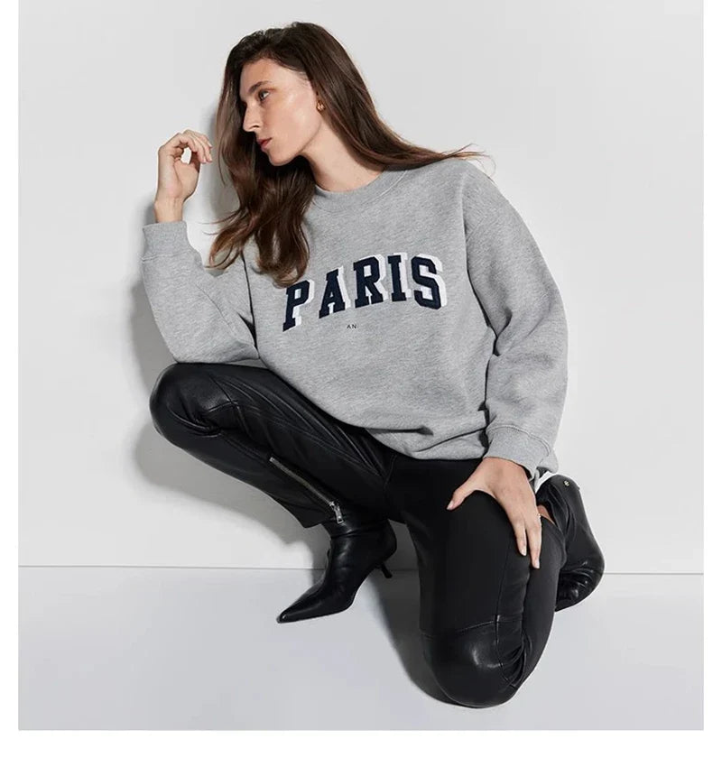 Women's long sleeve crew neck sweatshirt with front graphic detail