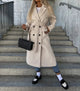 Women's long double-breasted trench coat with belt and lapels