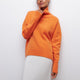 Women's relaxed turtleneck sweater with long sleeves and ribbed trims