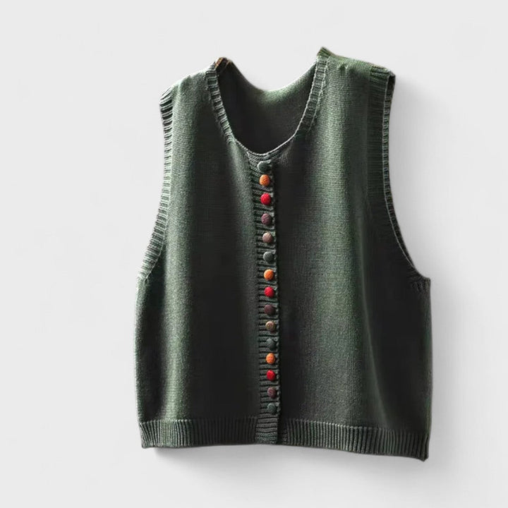 Women's sleeveless button front sweater vest layered over a shirt