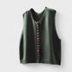 Women's sleeveless button front sweater vest layered over a shirt