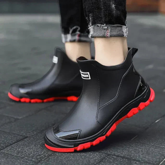 Pull-on terrain ankle boots with stitched panels and chunky textured soles