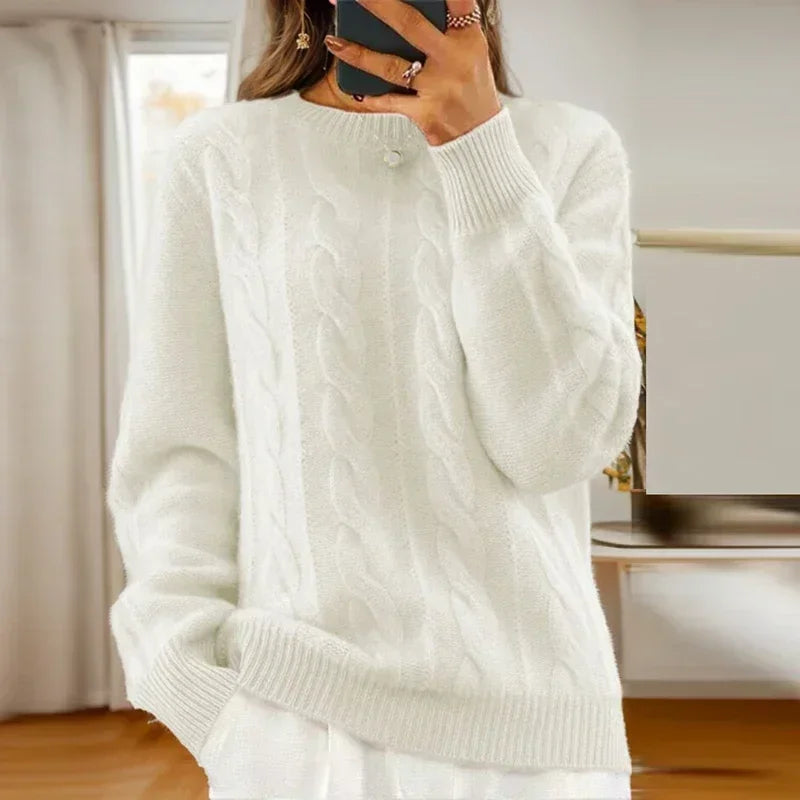 Women's cable knit crew neck sweater with long sleeves and ribbed trims