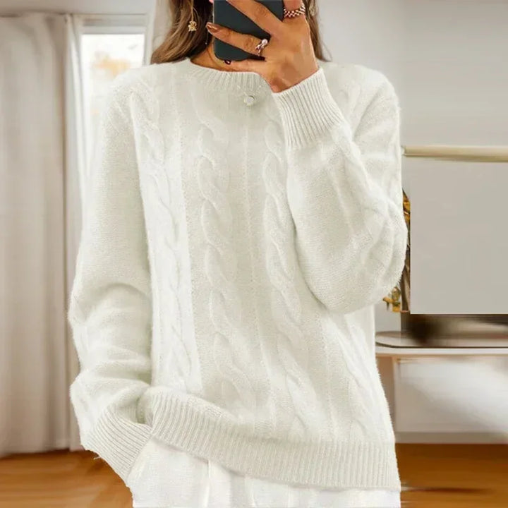 Women's cable knit crew neck sweater with long sleeves and ribbed trims